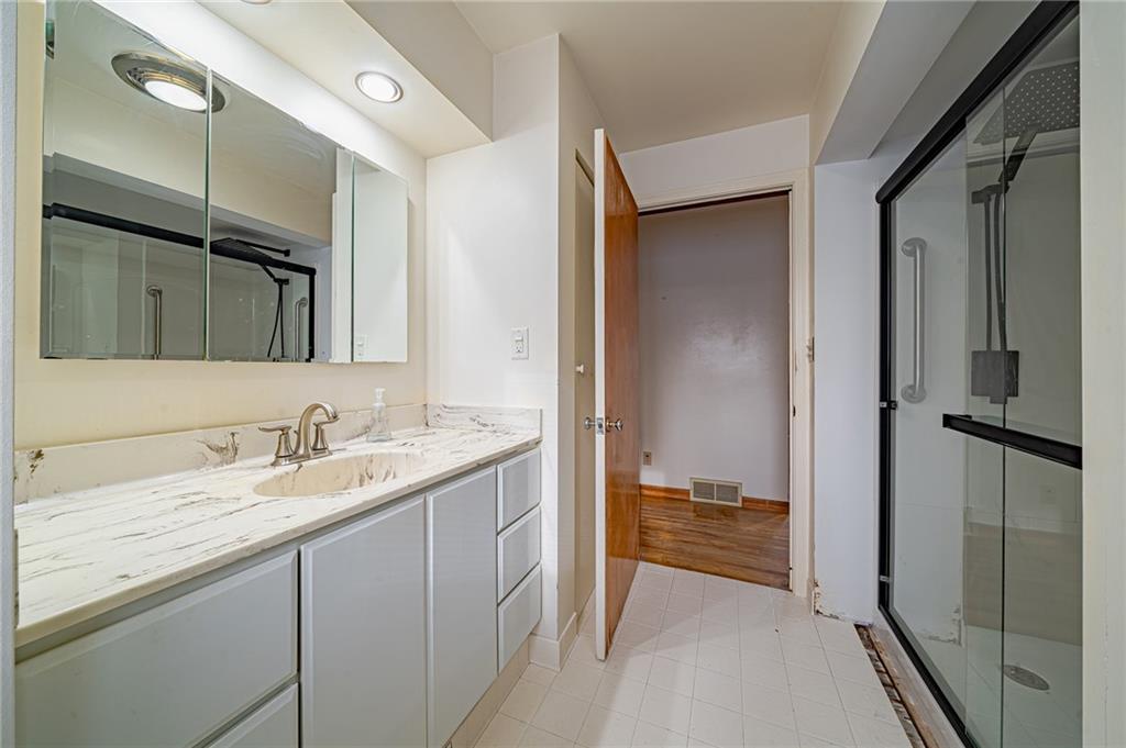 1316 Ridge Road Belle Vernon, PA 15012 - Photo 21 of 21 a bathroom with a sink and a mirror