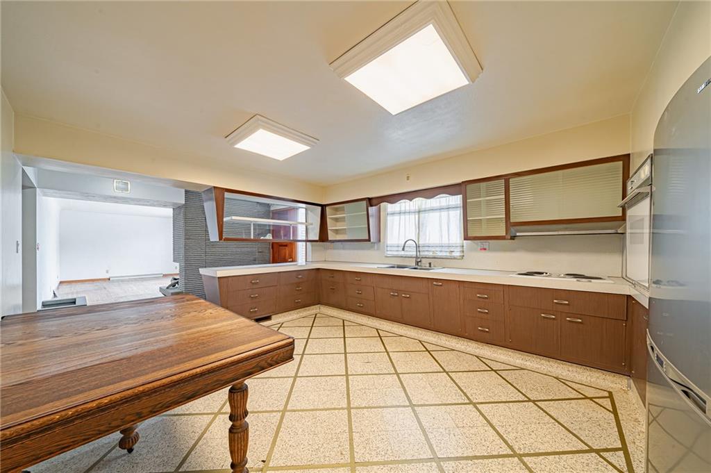 1316 Ridge Road Belle Vernon, PA 15012 - Photo 10 of 21 a room with gym equipment and view of living room