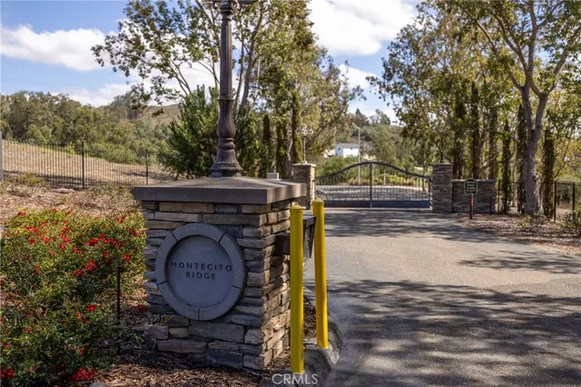 a wooden house with trees in front of it