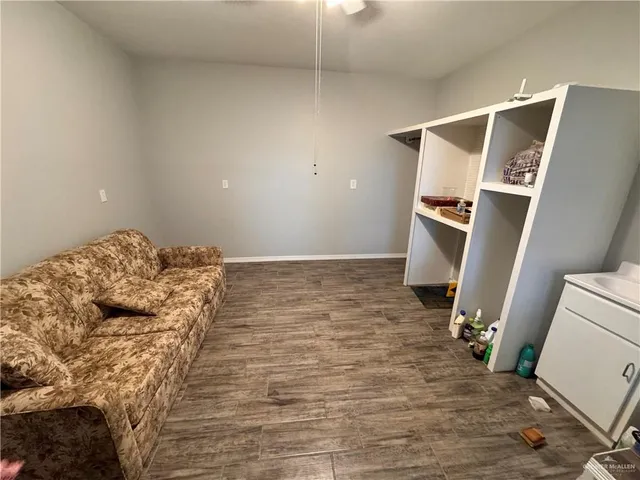 a bedroom with a bed and a mirror