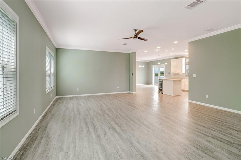 4835 East Riverside Drive Fort Myers, FL 33905 - Photo 11 of 35 a view of a kitchen with a sink and wooden floor