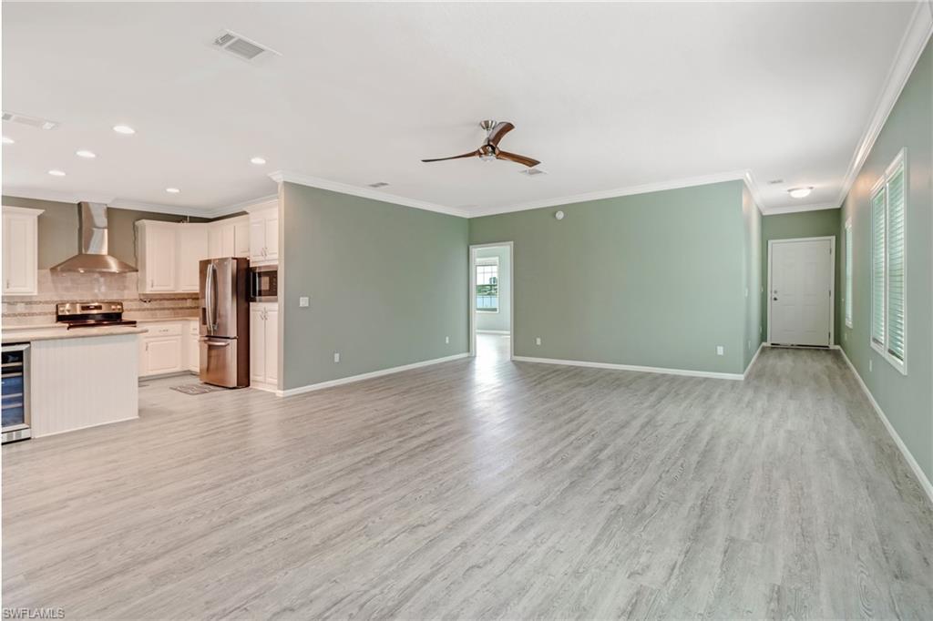 4835 East Riverside Drive Fort Myers, FL 33905 - Photo 12 of 35 a view of a kitchen with a sink and a refrigerator