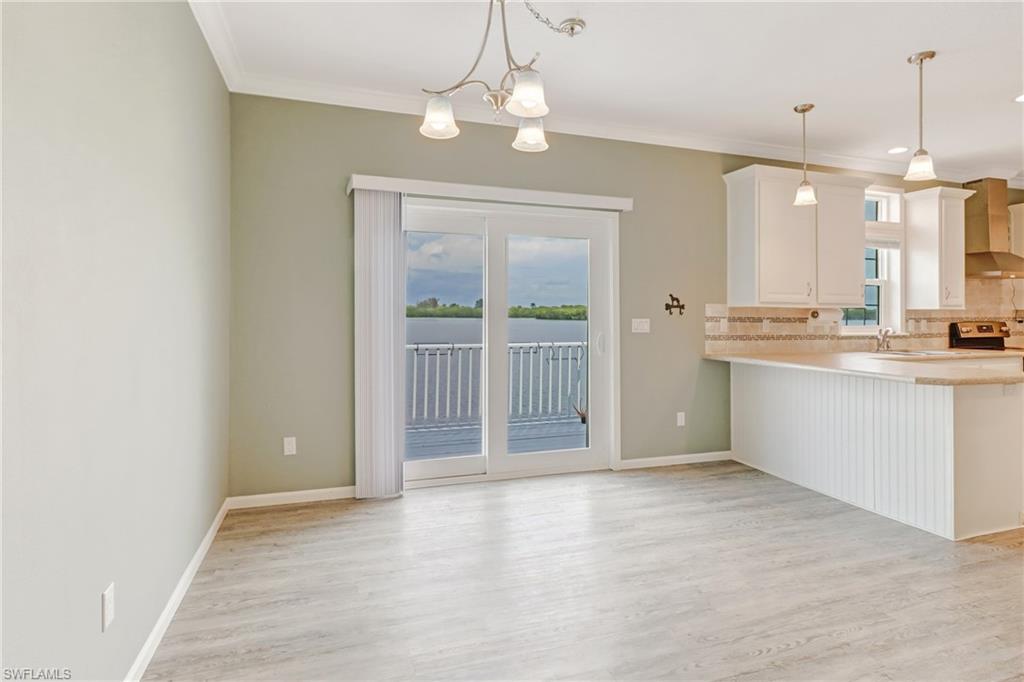4835 East Riverside Drive Fort Myers, FL 33905 - Photo 15 of 35 a view of a kitchen with a sink and a window
