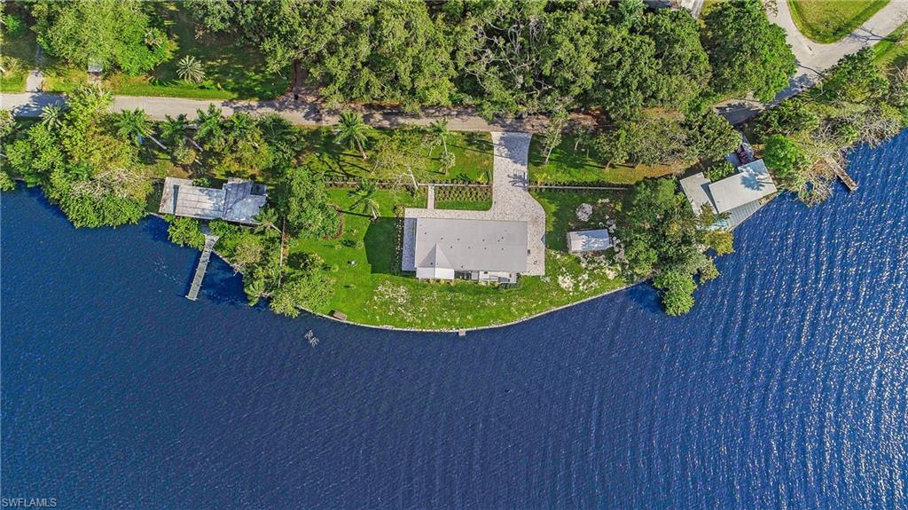 4835 East Riverside Drive Fort Myers, FL 33905 - Photo 20 of 35 a view of a small house with a yard