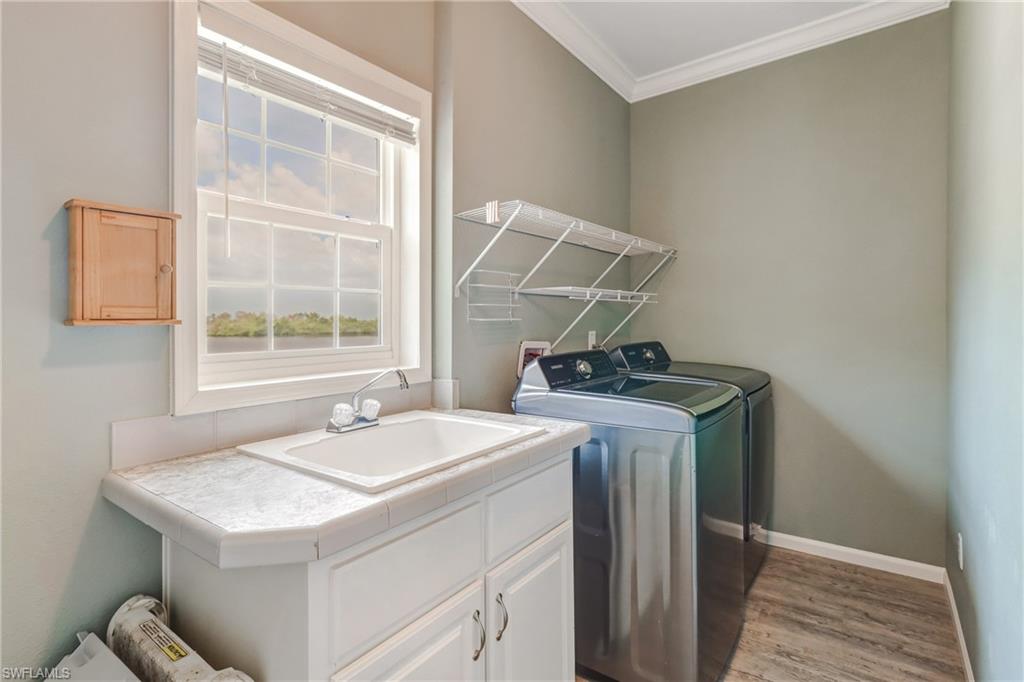 4835 East Riverside Drive Fort Myers, FL 33905 - Photo 28 of 35 a utility room with dryer and washer