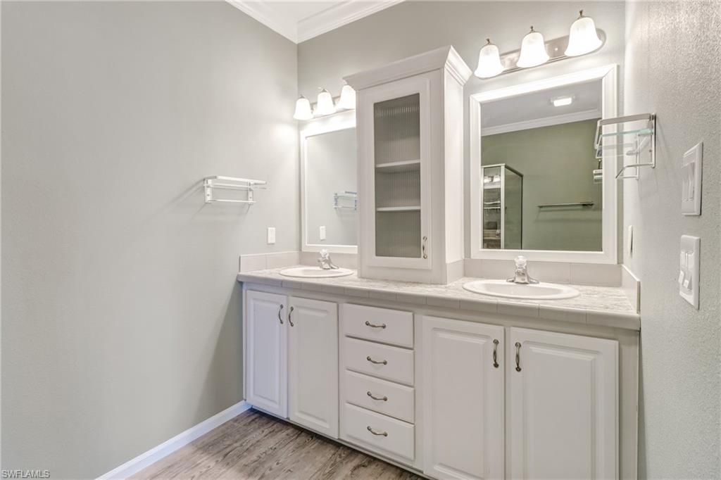 4835 East Riverside Drive Fort Myers, FL 33905 - Photo 34 of 35 a bathroom with double sink and a mirror