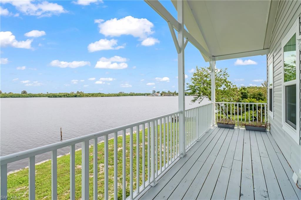 4835 East Riverside Drive Fort Myers, FL 33905 - Photo 4 of 35 a view of balcony with wooden floor and fence