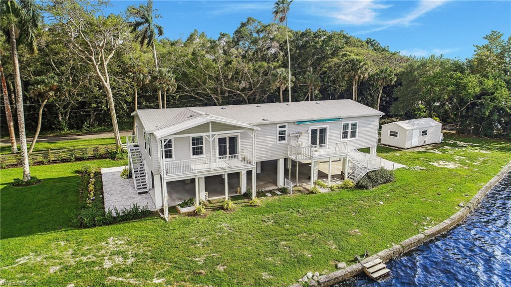 4835 East Riverside Drive Fort Myers, FL 33905 - Photo 5 of 35 a view of a house with a big yard