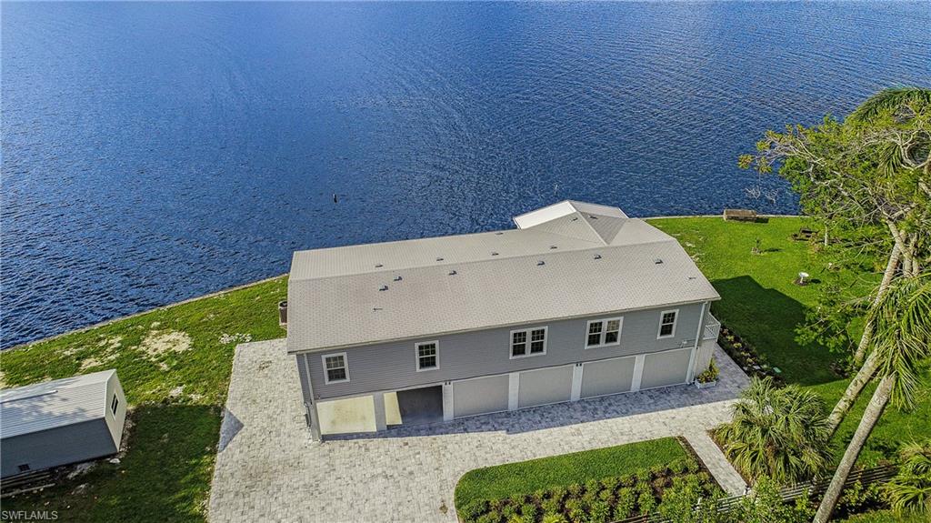 4835 East Riverside Drive Fort Myers, FL 33905 - Photo 8 of 35 an aerial view of a house with a yard