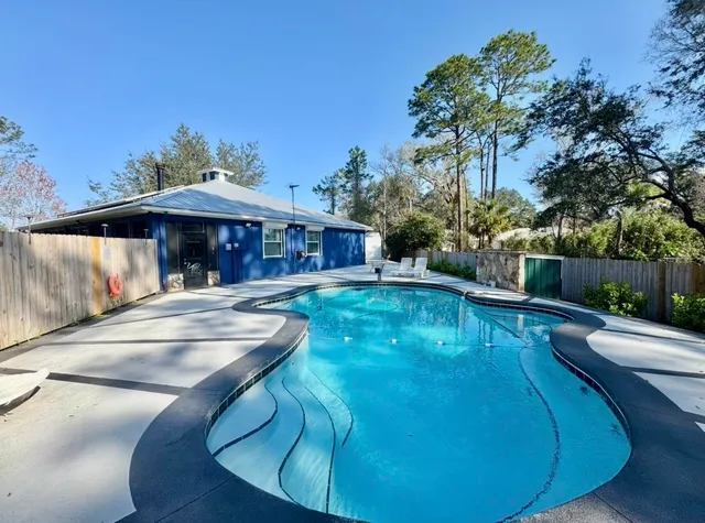a view of a swimming pool with a patio