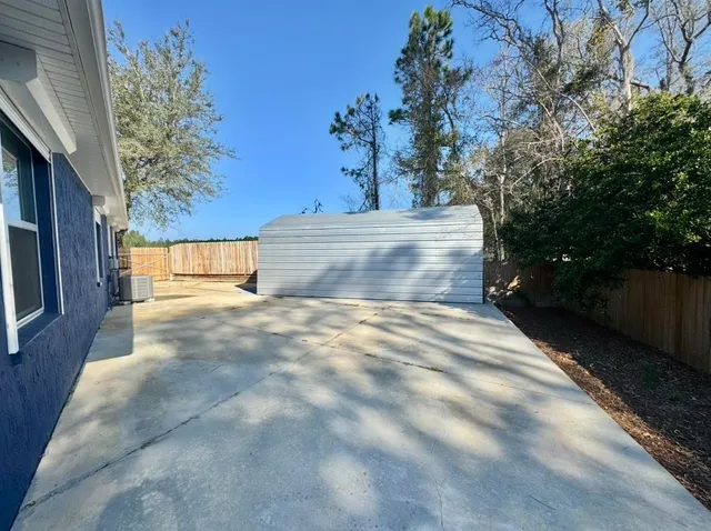 a view of backyard of a house