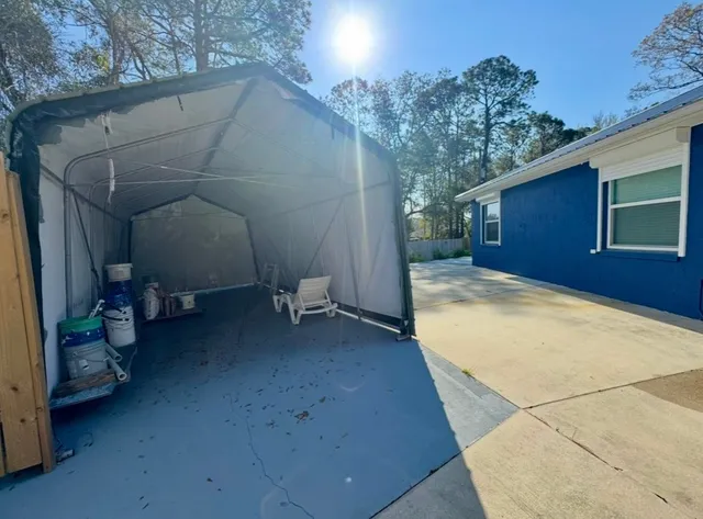 a view of backyard and utility room