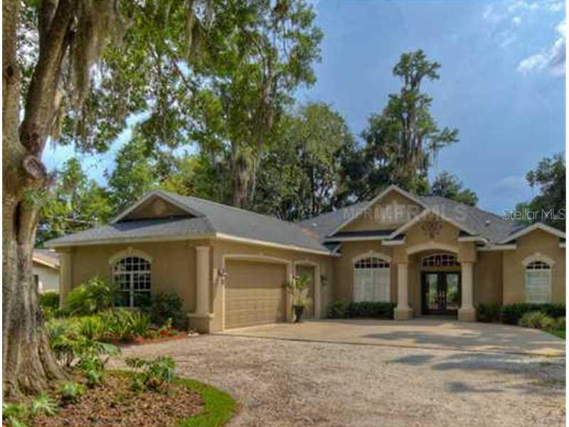 19264 Blount Road Lutz, FL 33558 - Photo 1 of 1 a front view of a house with a yard