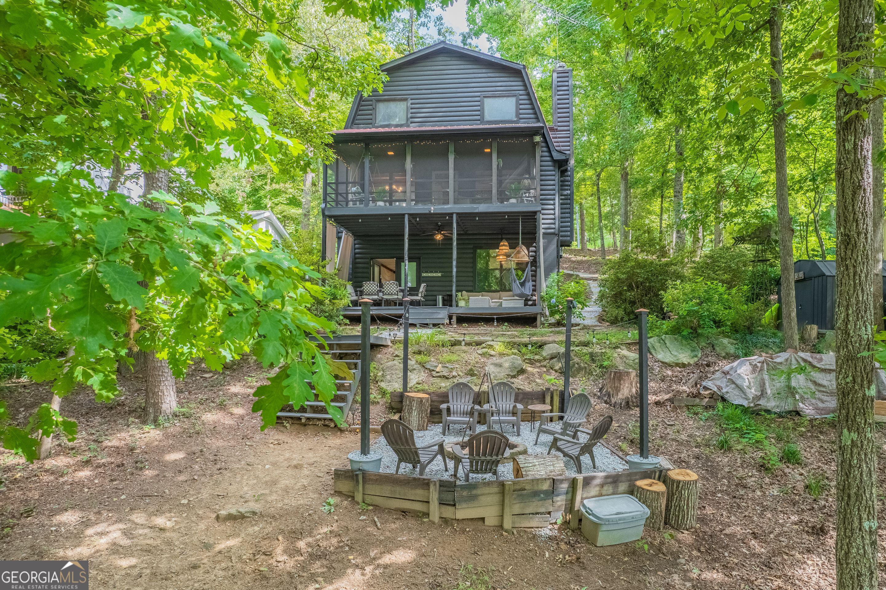 78 River Ridge Road, Unit 29 Martin, GA 30557 - Photo 2 of 21 a view of a chair and table in backyard of the house