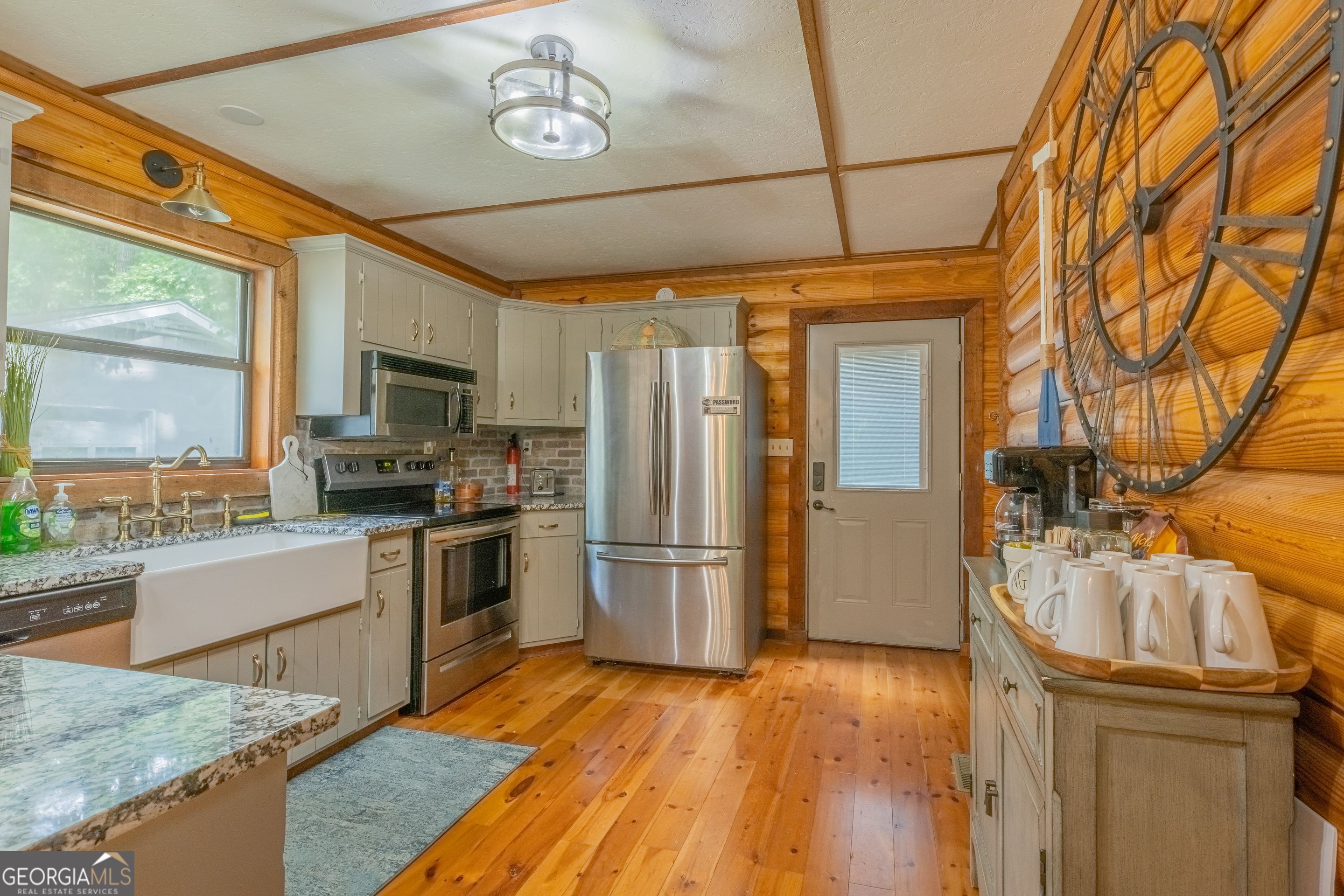 78 River Ridge Road, Unit 29 Martin, GA 30557 - Photo 8 of 21 a kitchen with stainless steel appliances granite countertop a refrigerator a stove and a wooden floors