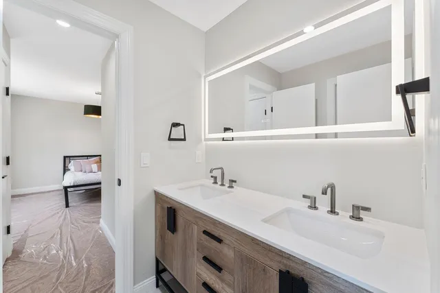 a bathroom with a sink and a mirror