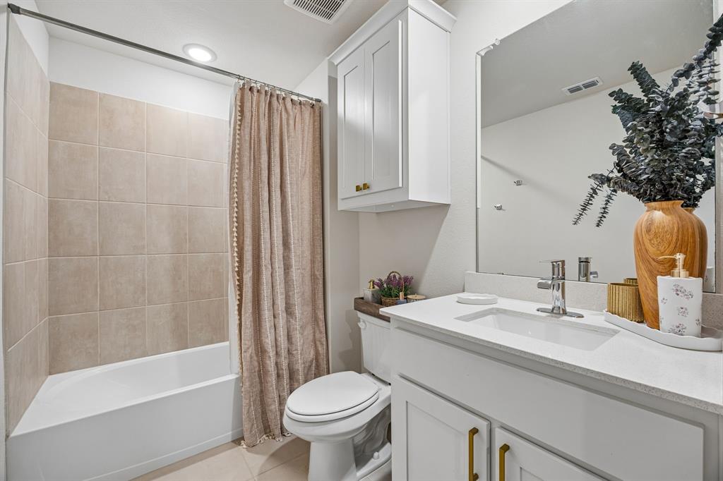425 Breeds Hl Road Little Elm, TX 75068 - Photo 27 of 38 a bathroom with a sink toilet and shower