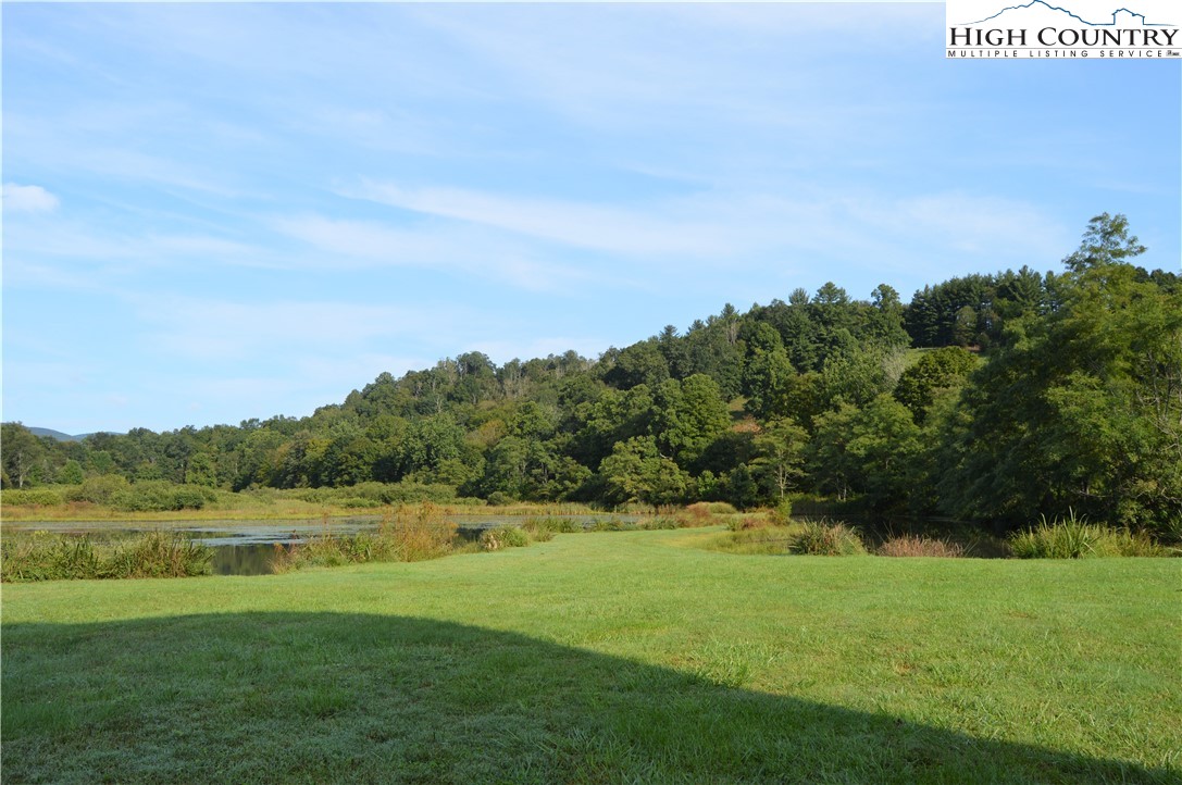 Lot 18 Charity Drive Boone, NC 28607 - Photo 15 of 18 a view of a lake with a big yard