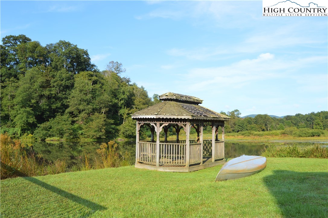Lot 18 Charity Drive Boone, NC 28607 - Photo 16 of 18 a big white house with a big yard and large trees