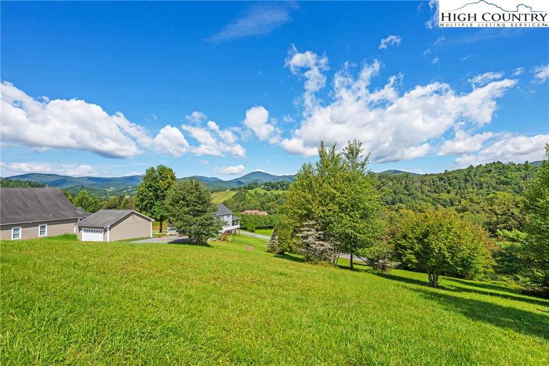 Lot 18 Charity Drive Boone, NC 28607 - Photo 2 of 18 a view of a house with a yard