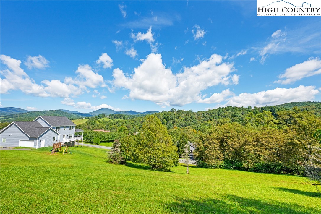 Lot 18 Charity Drive Boone, NC 28607 - Photo 9 of 18 a view of a big yard with potted plants and large tree