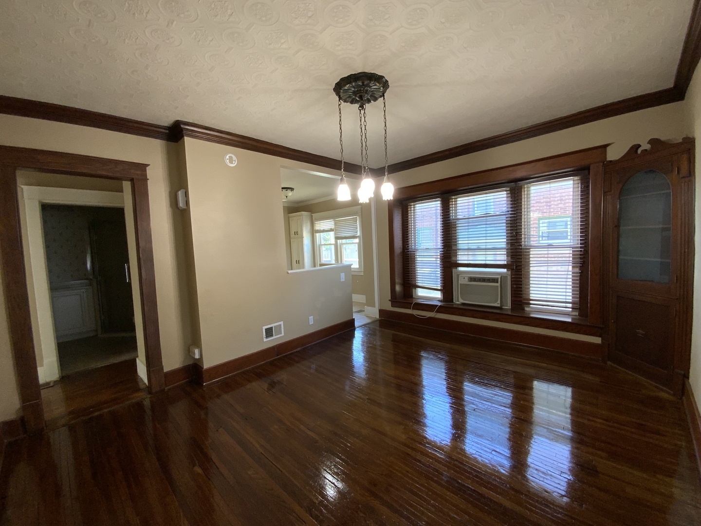 123 North Gilbert Street Danville, IL 61832 - Photo 4 of 8 wooden floor in an empty room with a window