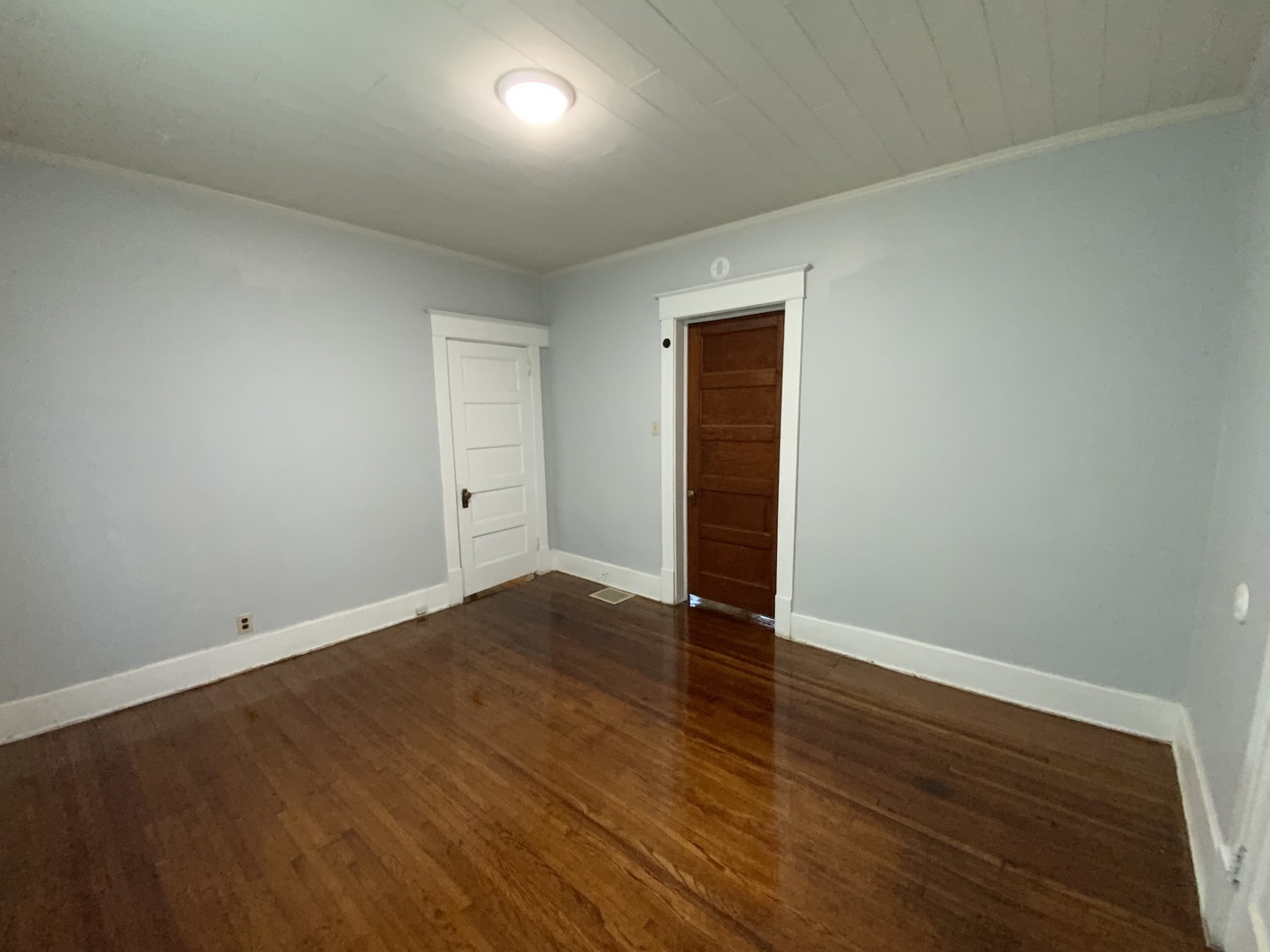 123 North Gilbert Street Danville, IL 61832 - Photo 7 of 8 an empty room with wooden floor