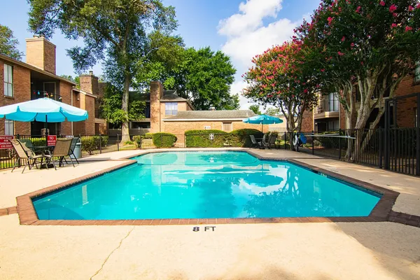 a view of swimming pool with chairs