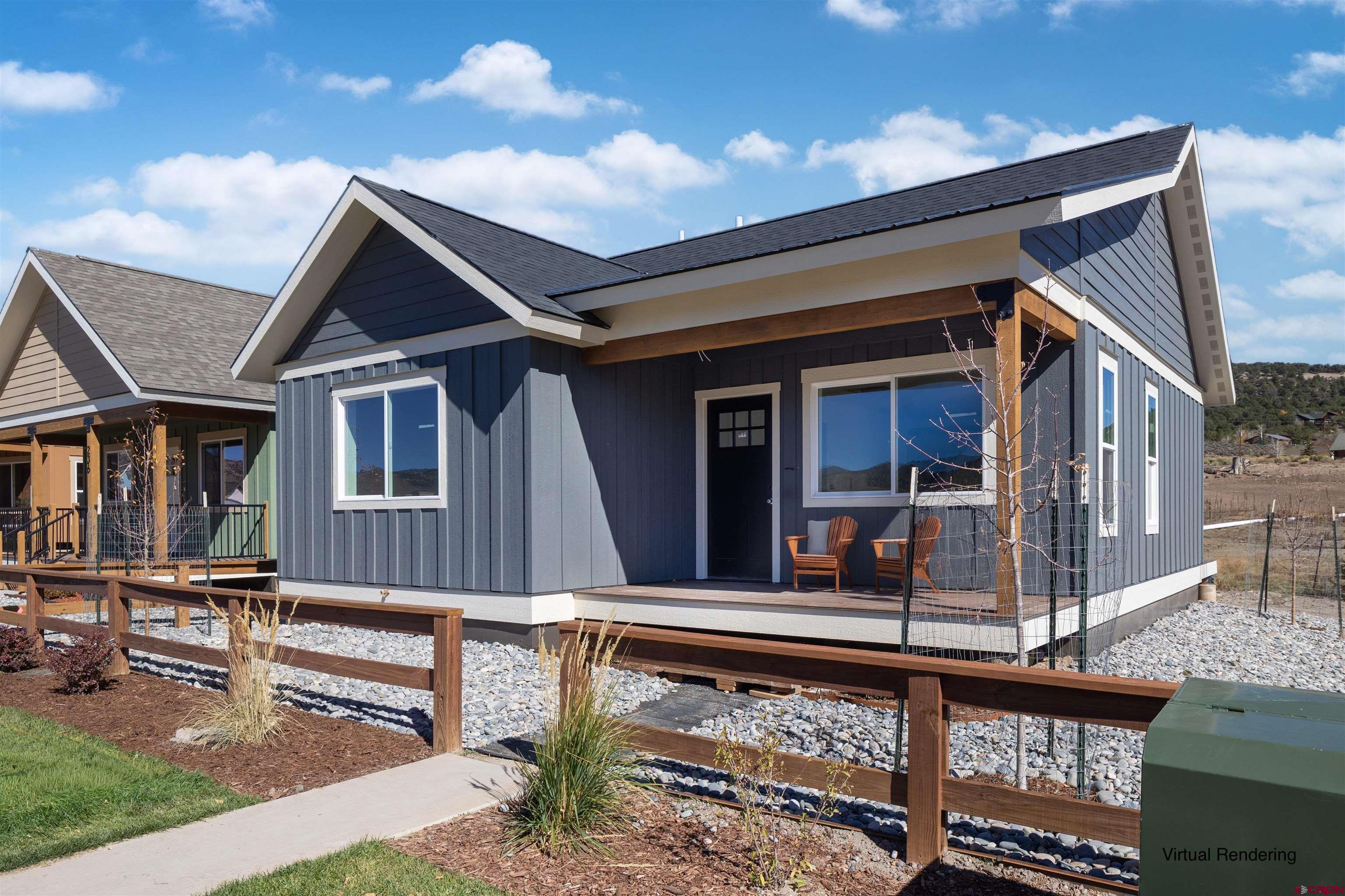 228 Redcliff Drive Ridgway, CO 81432 - Photo 1 of 35 a front view of a house with porch