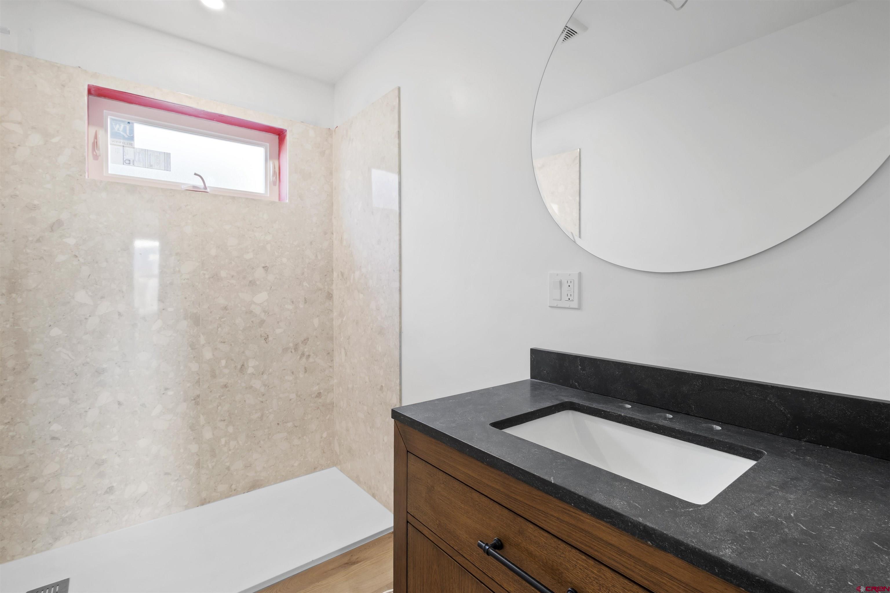 228 Redcliff Drive Ridgway, CO 81432 - Photo 13 of 35 a bathroom with a tub sink and mirror