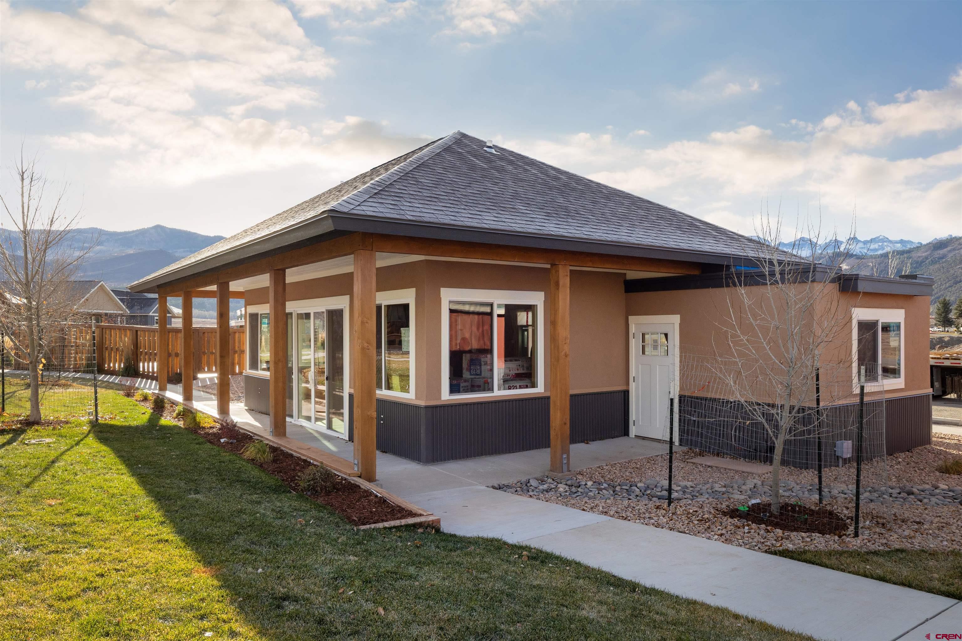 228 Redcliff Drive Ridgway, CO 81432 - Photo 15 of 35 a front view of a house with garden