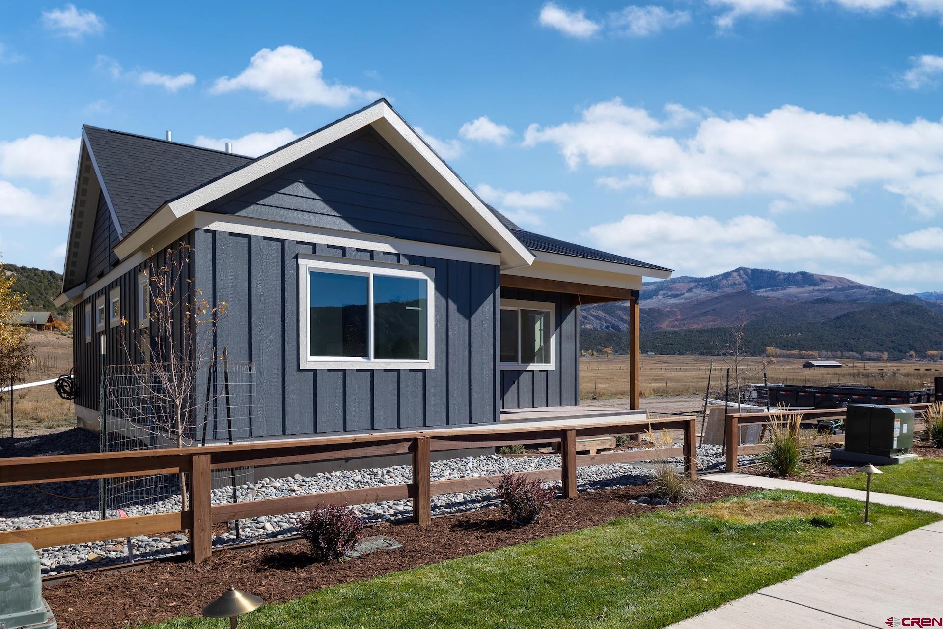 228 Redcliff Drive Ridgway, CO 81432 - Photo 2 of 35 a house view with a garden space