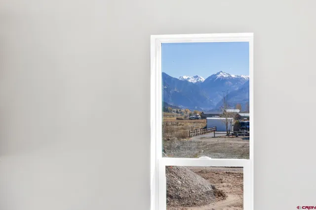 a view of a living room with a painting on the wall