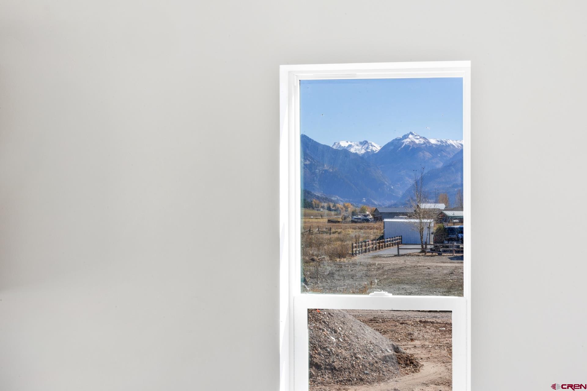 228 Redcliff Drive Ridgway, CO 81432 - Photo 21 of 35 a view of a living room with a painting on the wall