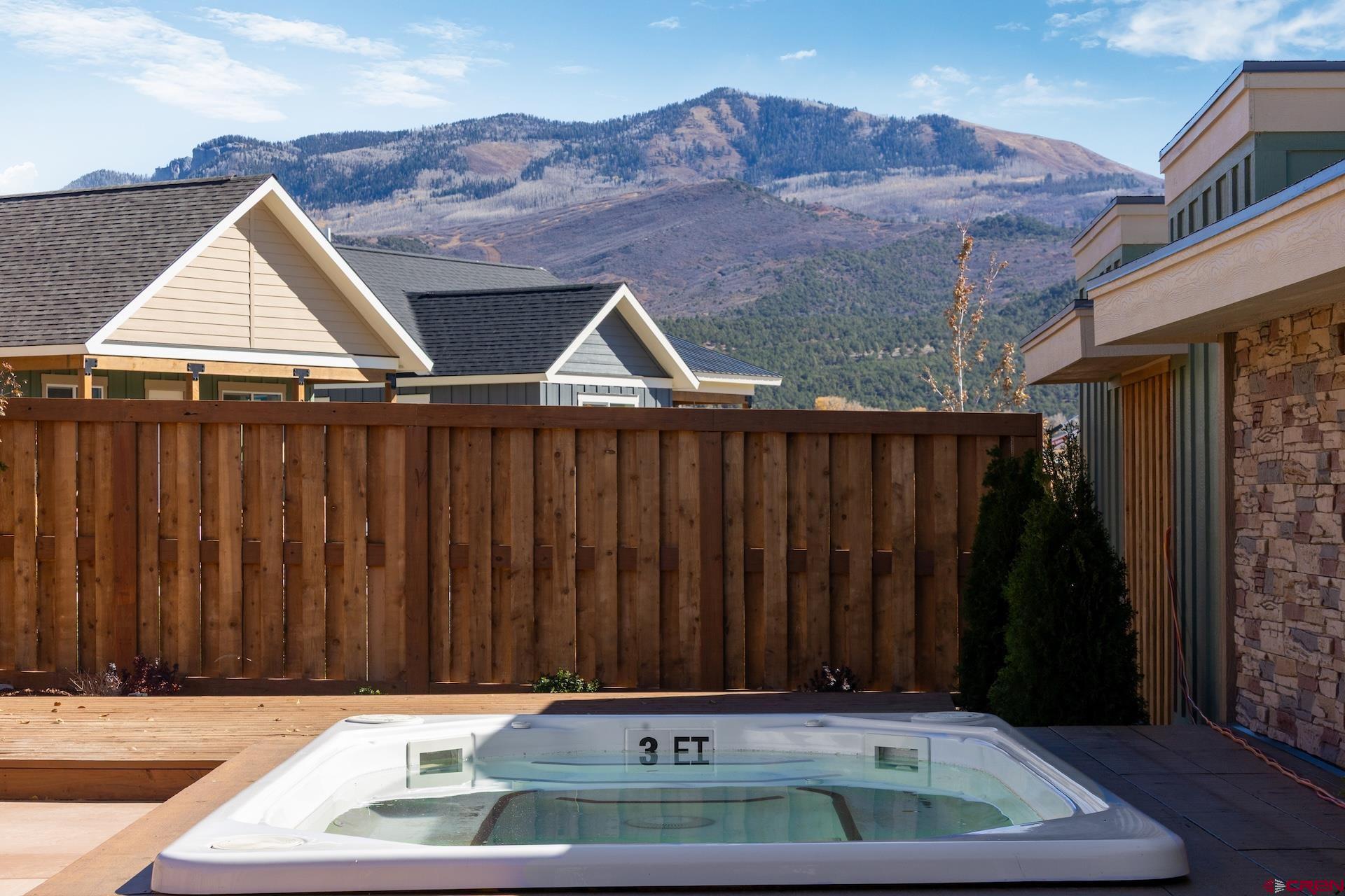 228 Redcliff Drive Ridgway, CO 81432 - Photo 27 of 35 a front view of a house with wooden fence
