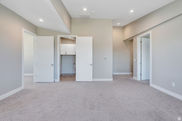 7045 South 300 East Midvale, UT 84047 - Photo 16 of 49 Spacious room featuring light gray carpeting and neutral wall paint