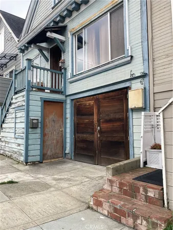 a view of a house with a parking space