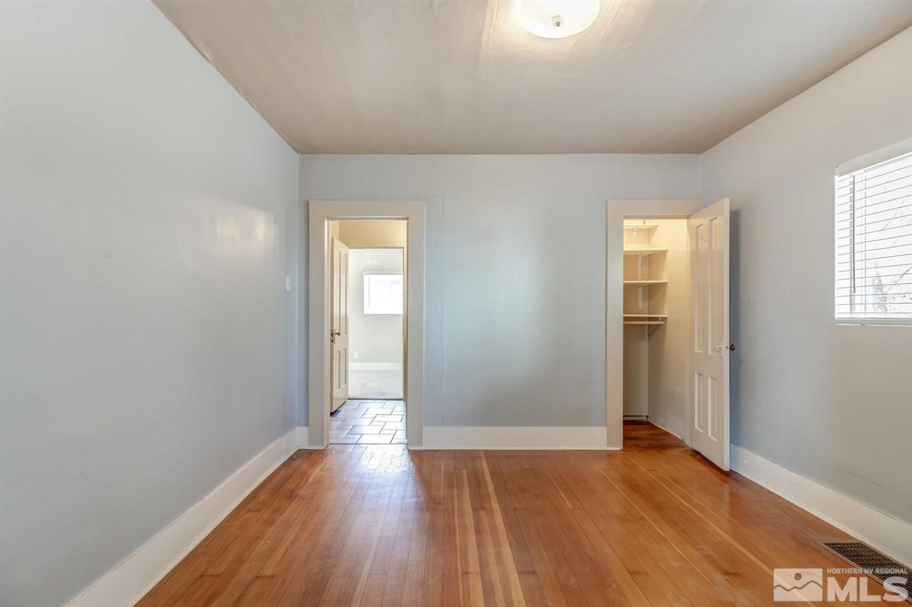 735 Plumas Street Reno, NV 89509 - Photo 11 of 25 an empty room with wooden floor and windows