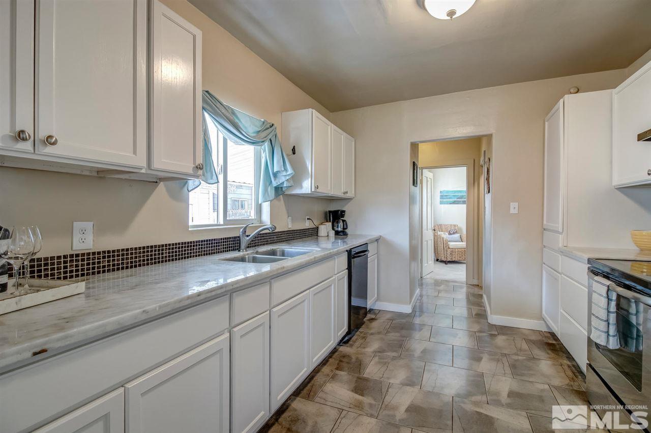 735 Plumas Street Reno, NV 89509 - Photo 13 of 25 a large kitchen with cabinets and a sink