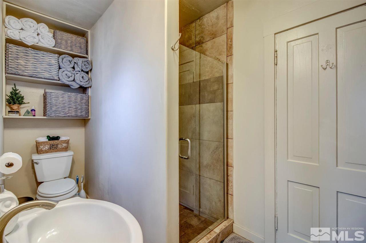 735 Plumas Street Reno, NV 89509 - Photo 16 of 25 a bathroom with a toilet and shower