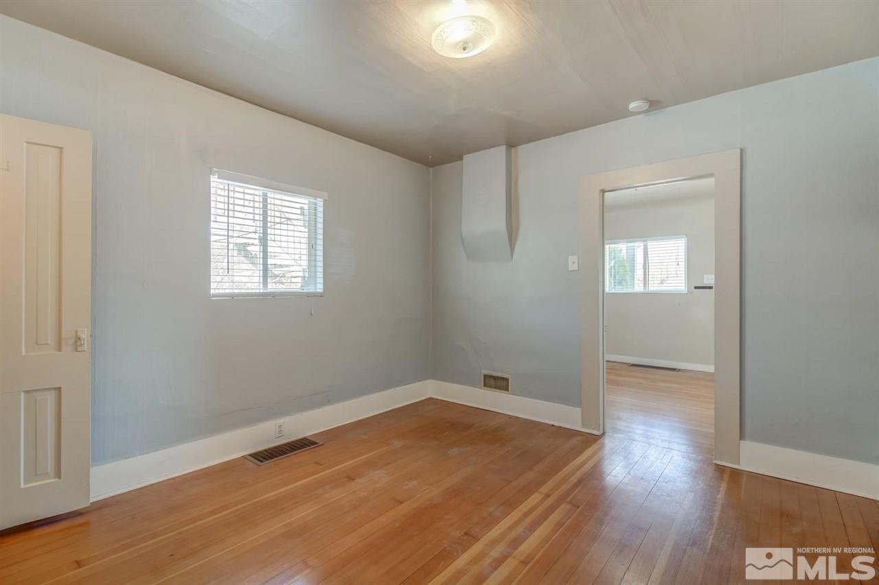 735 Plumas Street Reno, NV 89509 - Photo 19 of 25 an empty room with wooden floor and windows