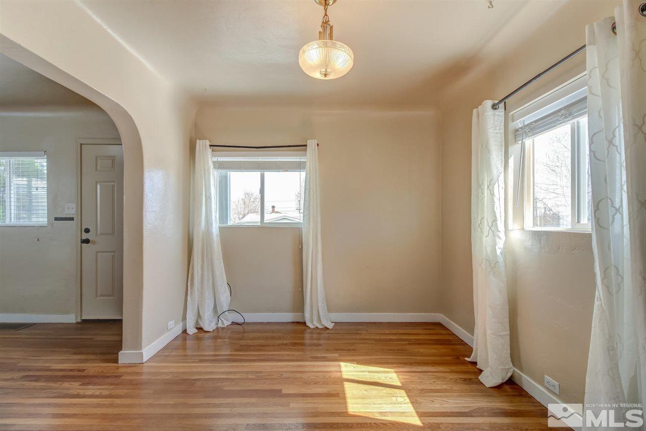 735 Plumas Street Reno, NV 89509 - Photo 7 of 25 a view of an empty room with wooden floor and a window