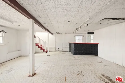 a view of a hallway with stairs