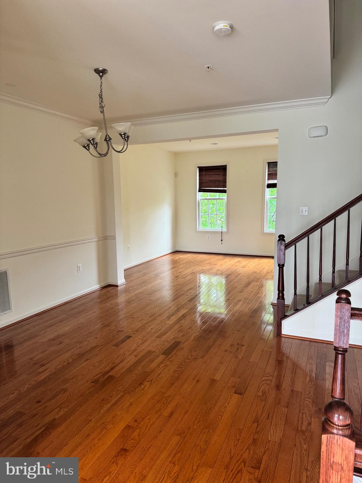 1608 Poplar Run Drive Silver Spring, MD 20906 - Photo 12 of 18 a view of an empty room with wooden floor and a window