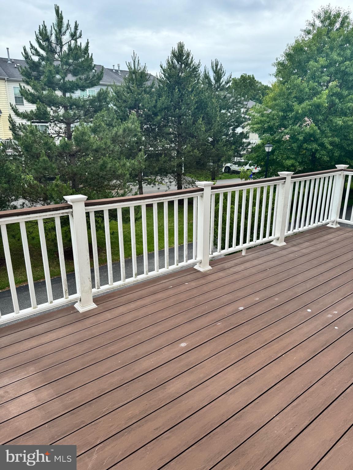 1608 Poplar Run Drive Silver Spring, MD 20906 - Photo 16 of 18 a balcony with wooden floor and trees in the back