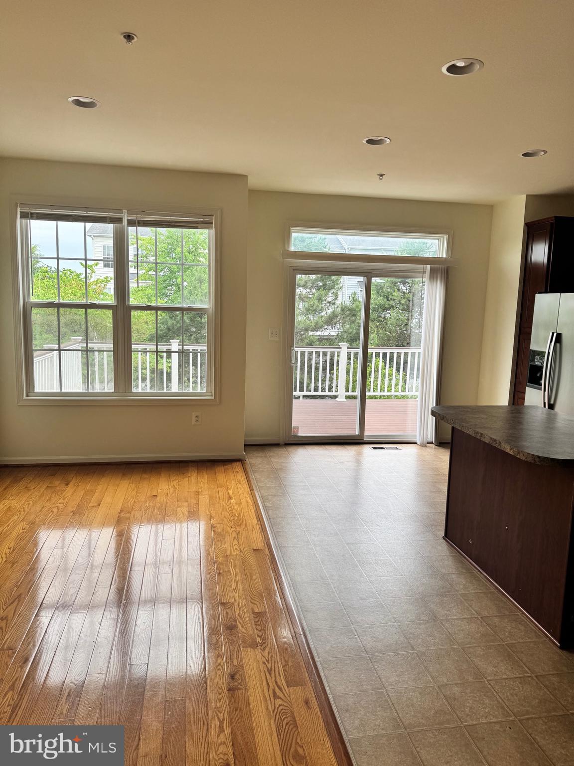 1608 Poplar Run Drive Silver Spring, MD 20906 - Photo 3 of 18 wooden floor in an empty room with a window