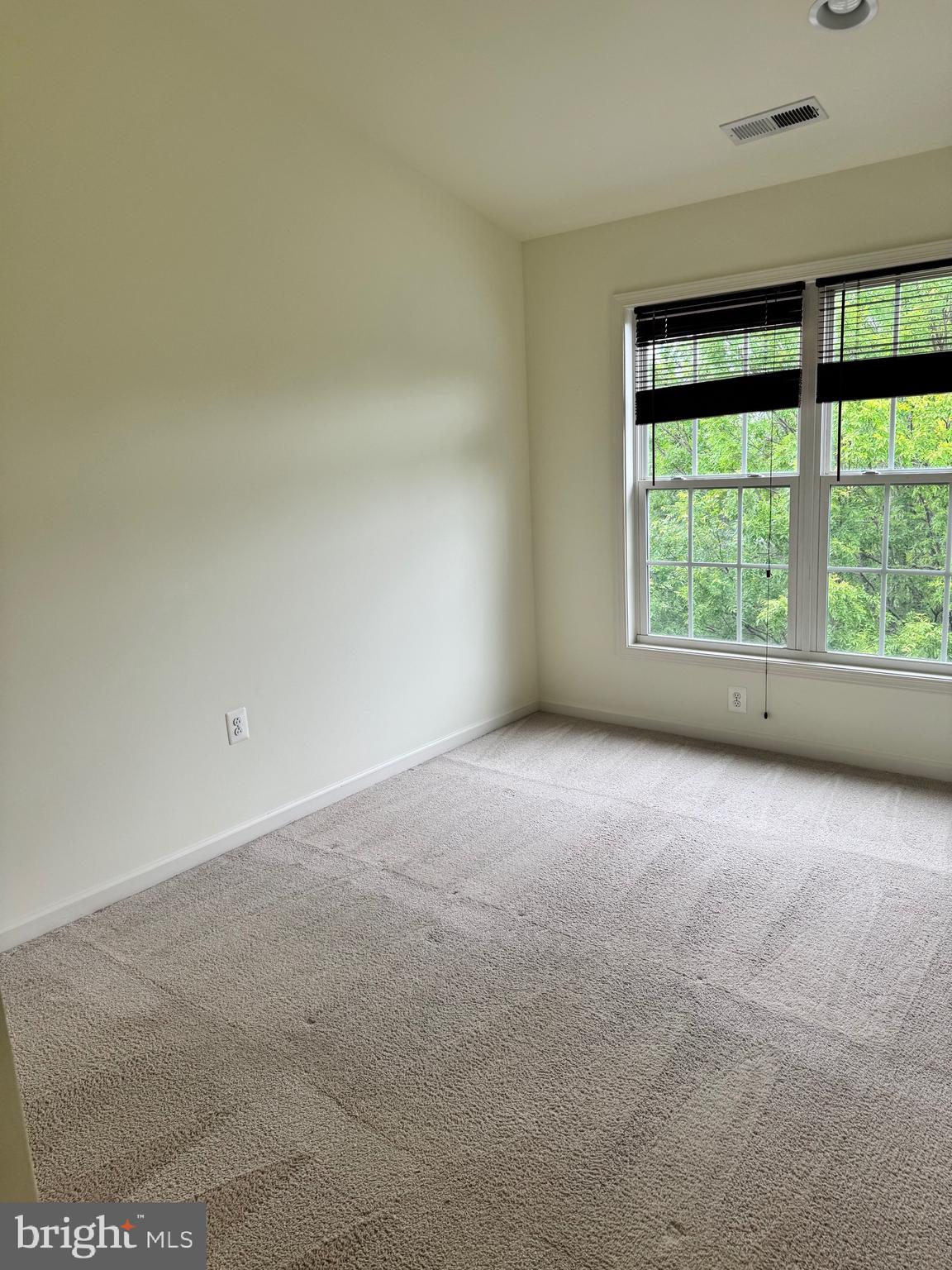 1608 Poplar Run Drive Silver Spring, MD 20906 - Photo 5 of 18 a view of an empty room with a window