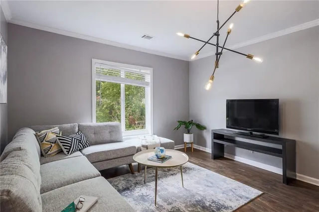 a living room with furniture and a flat screen tv