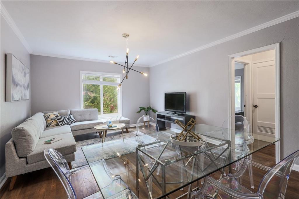 1507 Pease Road, Unit 7 Austin, TX 78703 - Photo 7 of 11 a living room with furniture and a flat screen tv