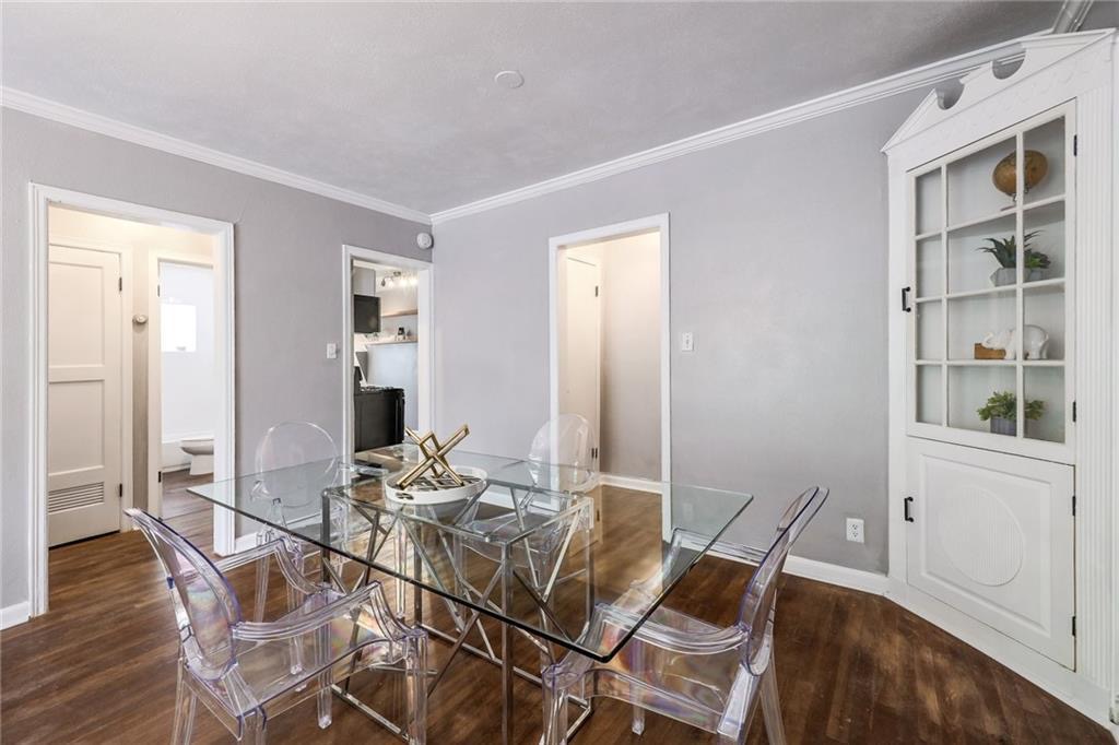 1507 Pease Road, Unit 7 Austin, TX 78703 - Photo 9 of 11 a view of a dining room with furniture and wooden floor